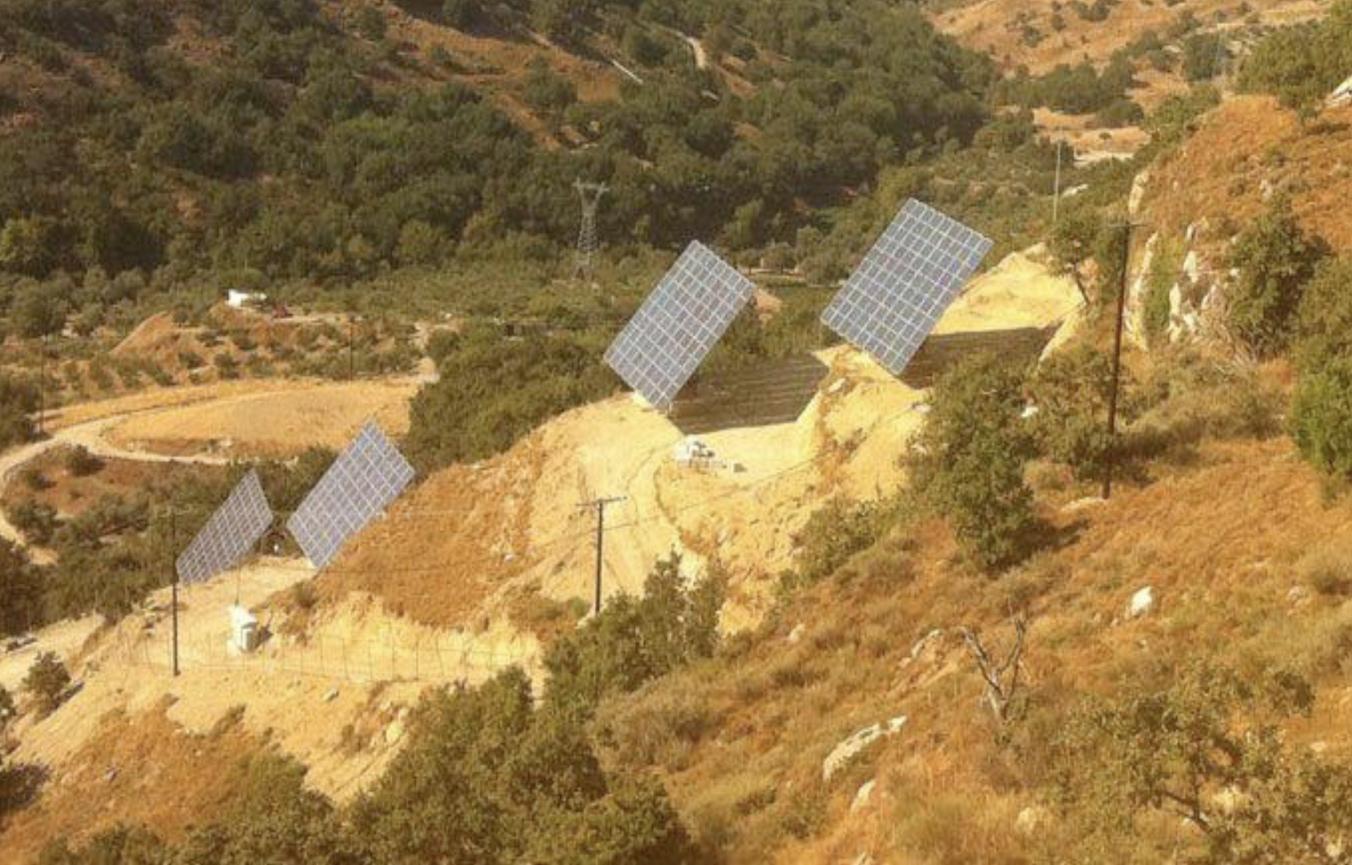 Mechatron dual-axis solar trackers on hillside